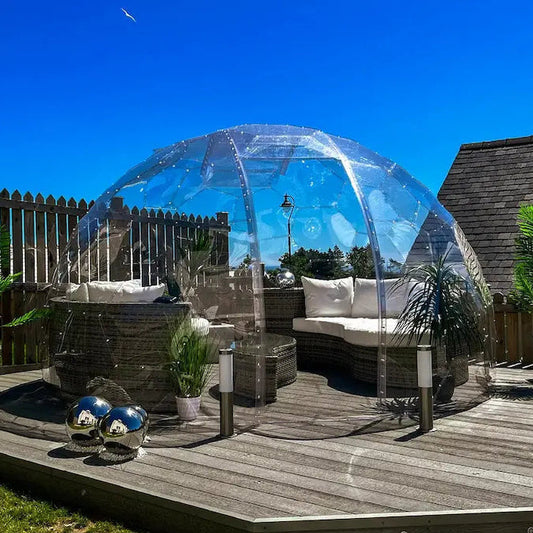 A GeoDomeX garden dome on timber decking on a sunny day